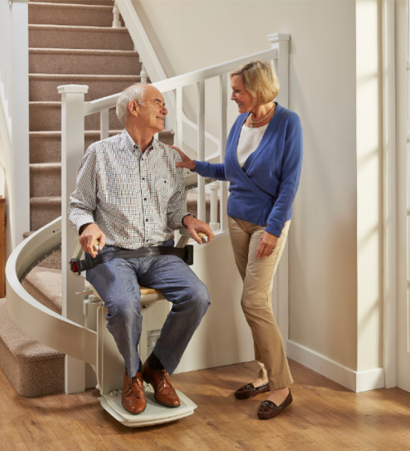 Couple enjoying the acorn curved stairlift